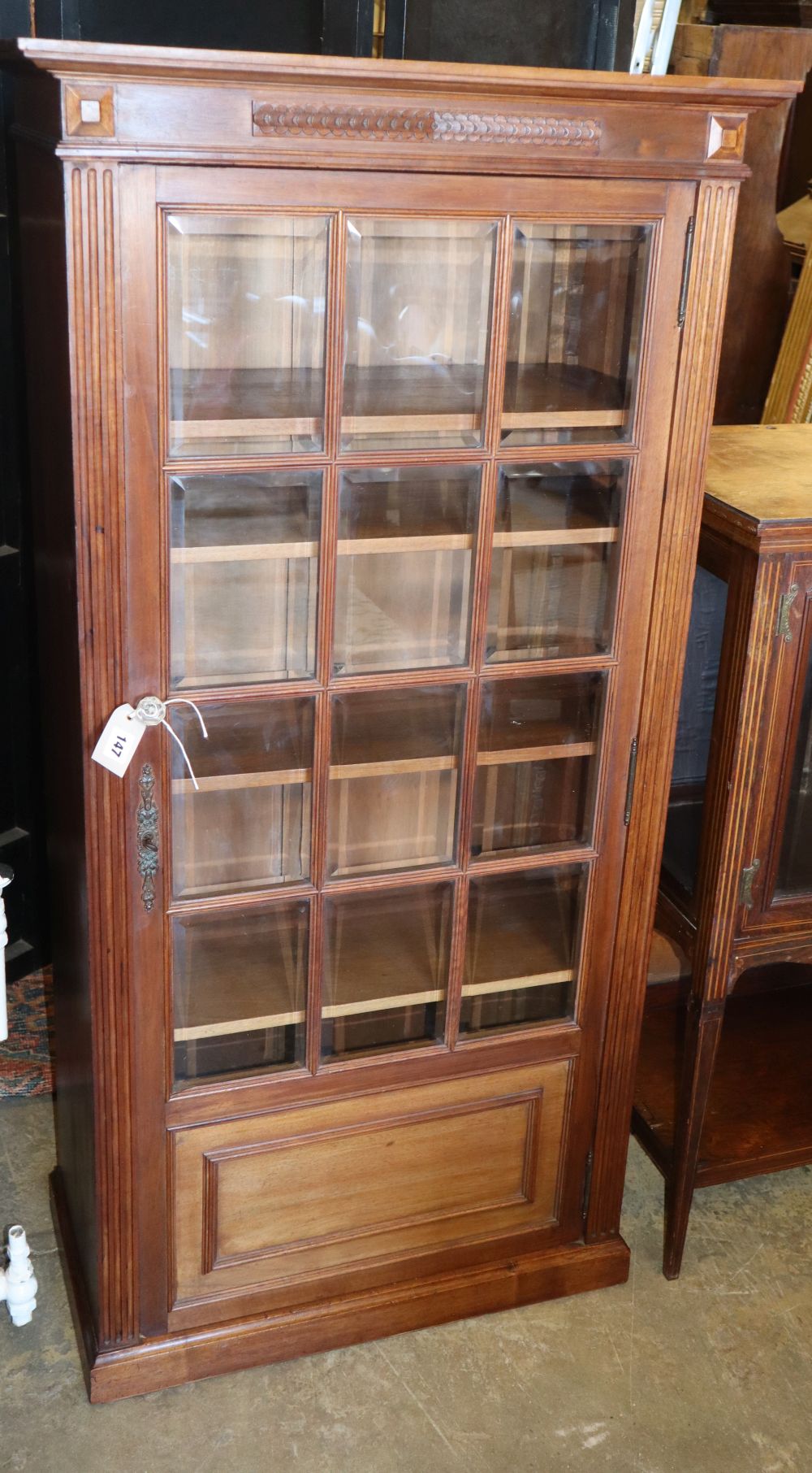 An early 20th century French walnut glazed display cabinet, W.70cm, D.36cm, H.140cm
